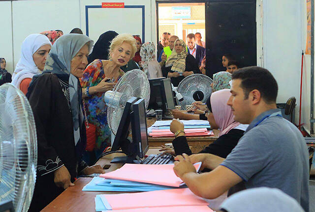 Jordanians take part in the local elections at a polling centre in Amman on Tuesday (Photo by Osama Aqarbeh)