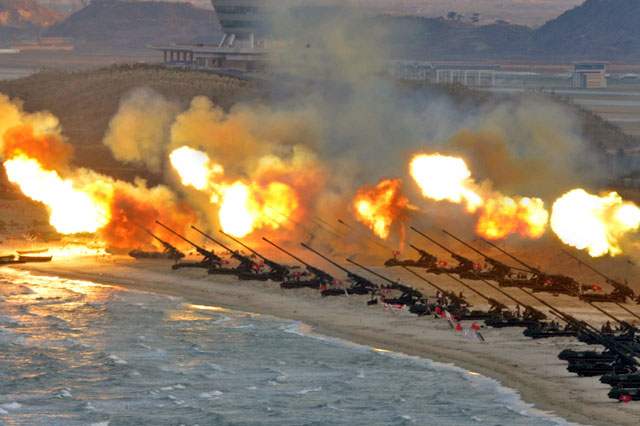  Artillery pieces are seen being fired during a military drill at an unknown location, in this undated photo released by North Korea’s Korean Central News Agency, on Friday (Reuters photo/KCNA)