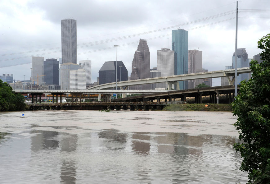 Floodwaters overrun the banks of a bayou in downtown Houston on Tuesday (AP photo)