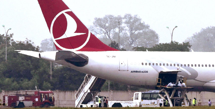 A Turkish Airlines passenger jet sits on the tarmac after it made an emergency landing at the Indira Gandhi International Airport in New Delhi on Tuesday (Reuters photo)
