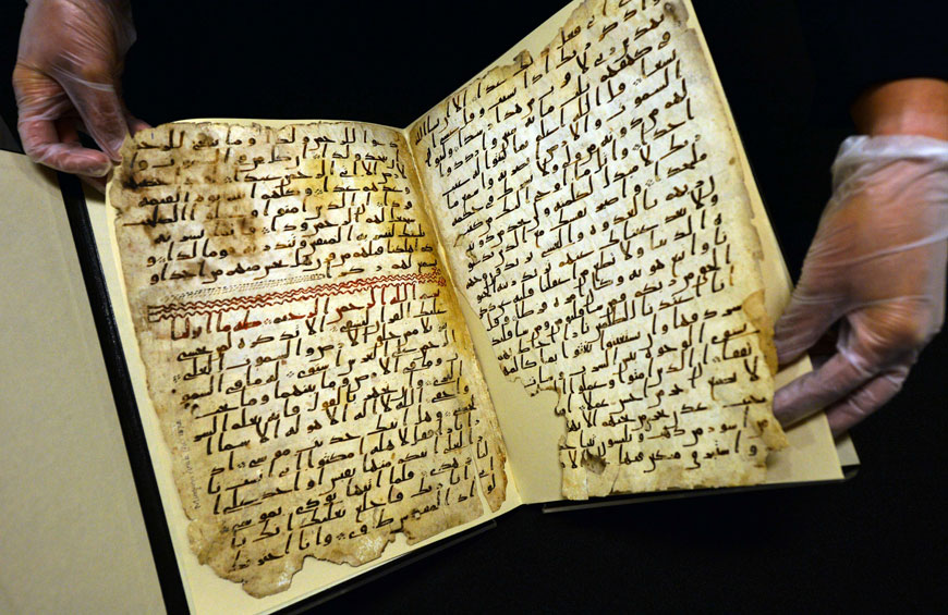 Marie Sviergula, conservator of the University of Birmingham holds a Koran mauscript in Birmingham England on Wednesday (AFP photo)