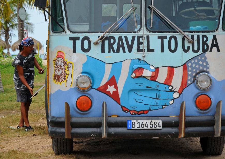 A bus with the Cuban and US flags is seen on a beach in Havana, on Wednesday (AFP photo)