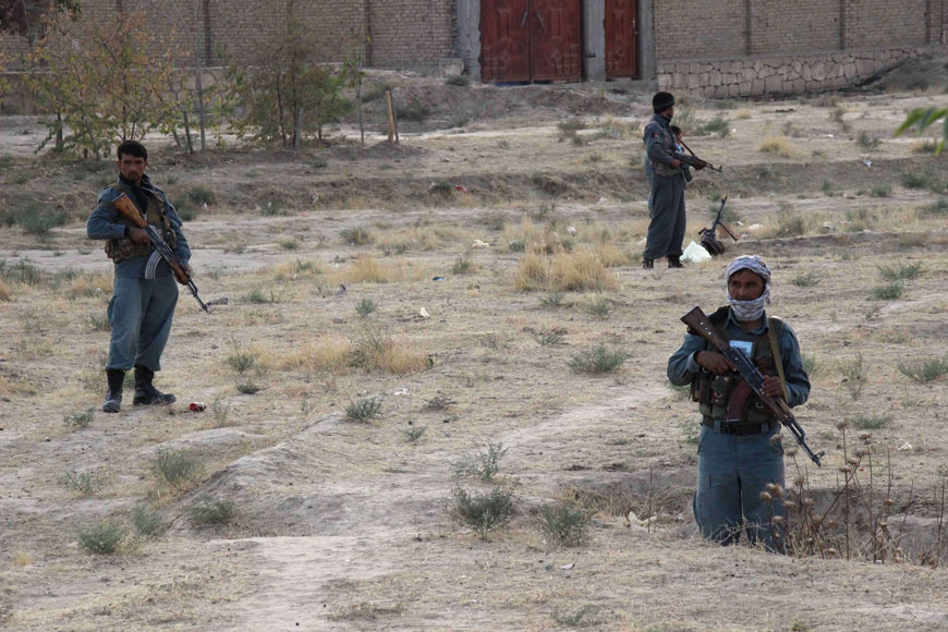 This photograph taken on Tuesday shows Afghan security personnel keeping watch as heavy fighting erupted near the airport on the outskirts of Kunduz (AFP photo)