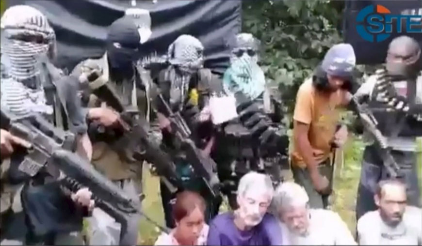 A photo captured from video footage of Philippine jihadists and kidnap victims is shown in this SITE Intelligence Group video made available to Reuters on Tuesday (Reuters photo/ SITE Intelligence Group)
