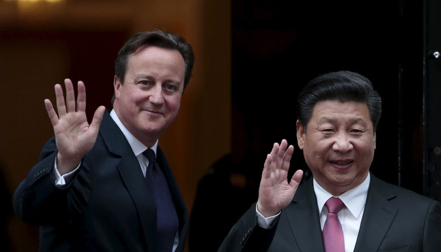 China’s President Xi Jinping is welcomed by Britain’s Prime Minister David Cameron to 10 Downing Street in central London, Britain, on Wednesday (Reuters photo)