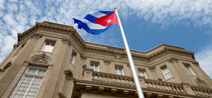 The Cuban flag is raised over their new embassy in Washington, DC, on Monday (AFP photo)