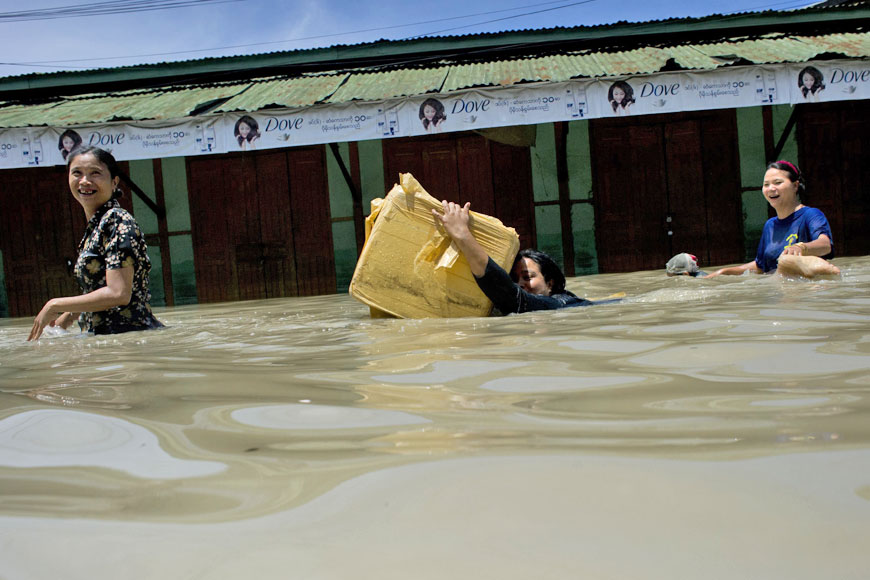 Residents wade through floodwaters in Kalay, upper Myanmar’s Sagaing region, on Sunday (AFP photo)