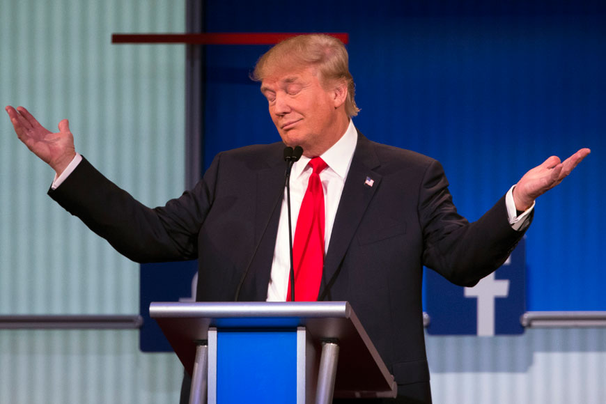 Republican presidential candidate Donald Trump gestures during the first Republican presidential debate at the Quicken Loans Arena in Cleveland on Thursday (AP photo)