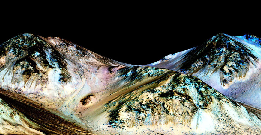 A handout image made available by NASA on Sunday shows dark, narrow, 100-metre long streaks called recurring slope lineae flowing downhill on Mars, inferred to have been formed by contemporary flowing water  (AFP photo/Nasa/Jpl/University of Arizona)