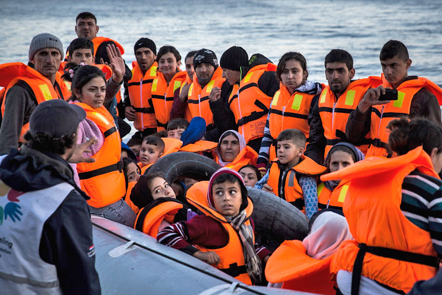 Syrian refugees disembark on the Greek island of Lesbos after crossing the Aegean Sea on a dinghy from the Turkish coast, on Saturday (AP photo)