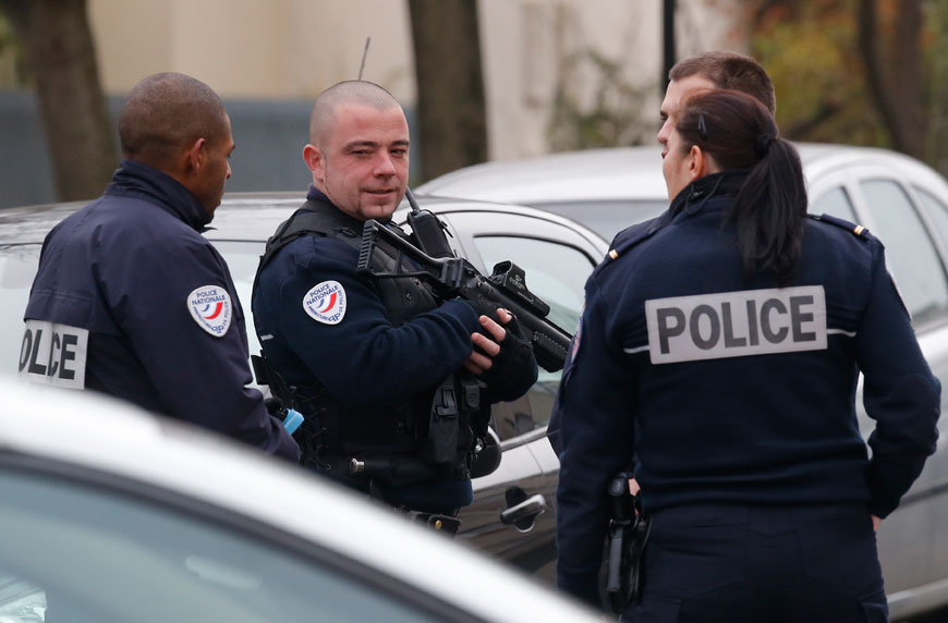 Police officers patrol near a pre-school in Paris suburb of Aubervilliers on Monday (AP photo)