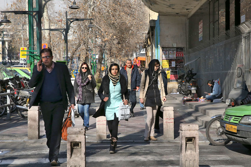 Pedestrians cross a street in central Tehran, Iran, on Saturday (AP photo by Vahid Salemi)