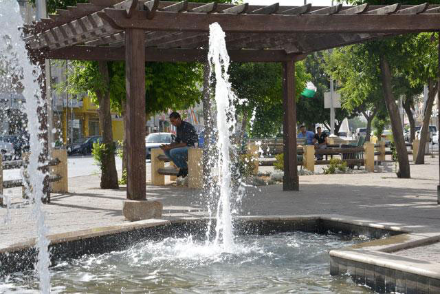 People rest in the shade at a public park in Amman in this file photo (JT file photo)