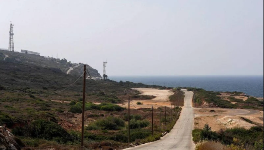 An October 3 view of the coastal road of Naqoura, the southernmost Lebanese town by the border, with an Israeli position in the background (AFP photo)