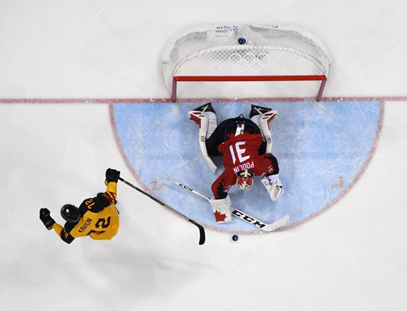 Canada’s Kevin Poulin stops Germany’s Dominik Kahun from scoring in their men’s semifinal ice hockey match during the 2018 Winter Olympic Games in Gangneung, South Korea, on Friday (AFP Jung Yeon-je)