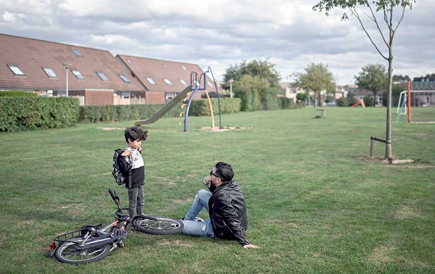 In this photograph taken on September 24, 32-year-old Ahmad (right) and his five-year-old son Adam play in a park in the town of Duiven, The Netherlands (AFP photo)
