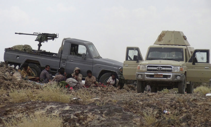 Yemeni tribesmen from the Popular Resistance Committees, supporting forces loyal to Yemen’s Saudi-backed fugitive President Abed Rabbo Mansour Hadi, sit next to their vehicles  on Friday (AFP photo)