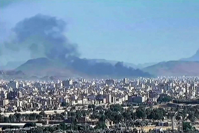 This image grab from a video released by Iran Press on January 10, 2025, shows smoke billowing during reported Israeli airstrikes as Yemenis rallied nearby in support of Palestinians in the Huthi-controlled capital Sanaa (AFP photo)