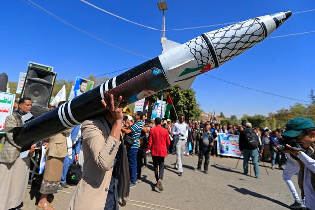 A Yemeni protester holds a mock rocket during an anti-Israel demonstration in the Huthi-controlled capital of Sanaa on January 22, 2025 (AFP photo)