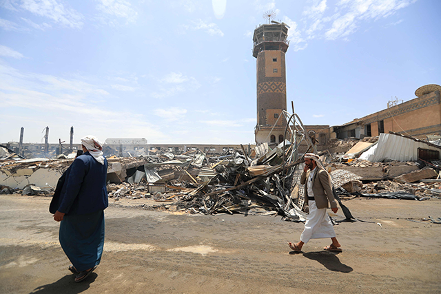 Journalists inspect the damage and debris at the Sanaa International Airport on May 7, 2025, a day after Israel's military warplanes struck Yemen's rebel-held capital Sanaa (AFP photo)