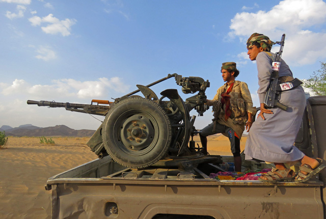 Fighters loyal to Yemen's Saudi-backed government man a position near Al Jawba frontline, facing Iran-backed Houthi rebels, in the country's northeastern province of Marib, on October 31 (AFP photo)